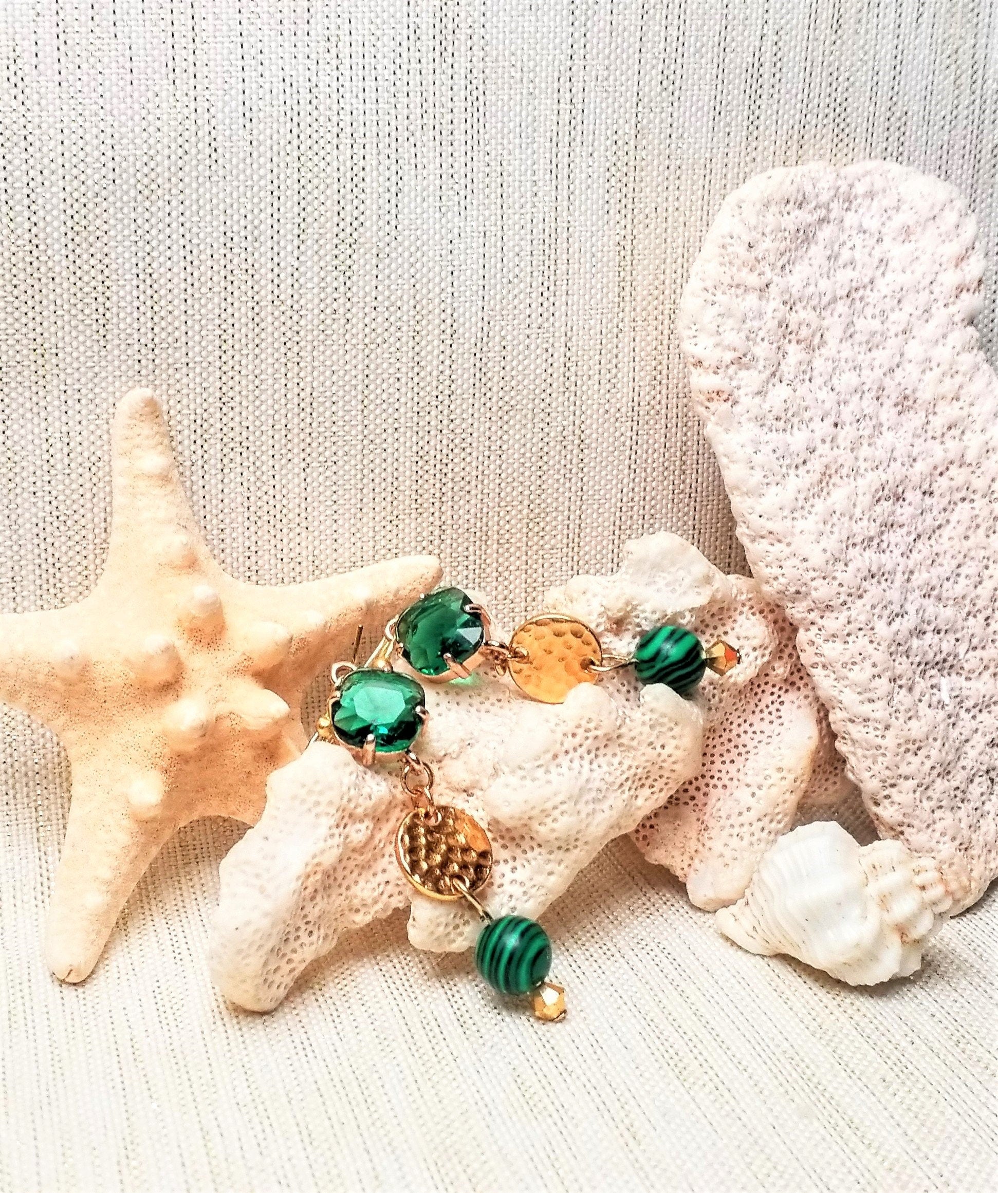 Elegant handcrafted earrings. Ideal for weddings and special occasions. Ear wires with beautiful very emerald green diamond shape crystals tops connected to a small golden circle and added pretty malachite stone bead hanging on the end.  Thank you!