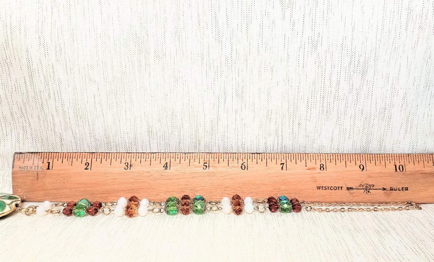 beautiful vintage cloisonne set with approximately 18 inch necklace and matching 1 inch earrings. elegant design includes crystal beads on necklace chain and drops on bottoms of pretty cloisonne medallions. the colors are green, amber and white.